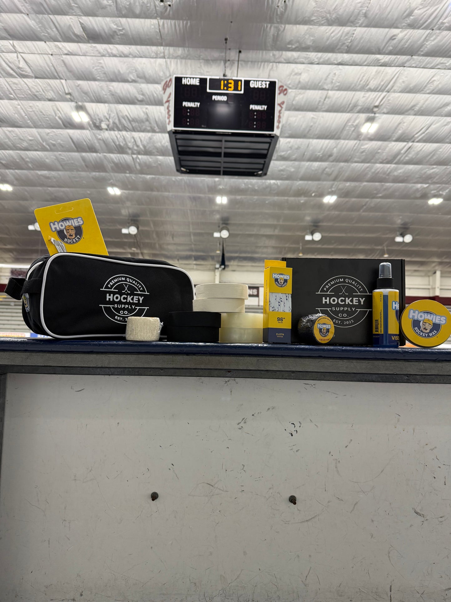 Hockey equipment including a stick and helmet on a textured surface