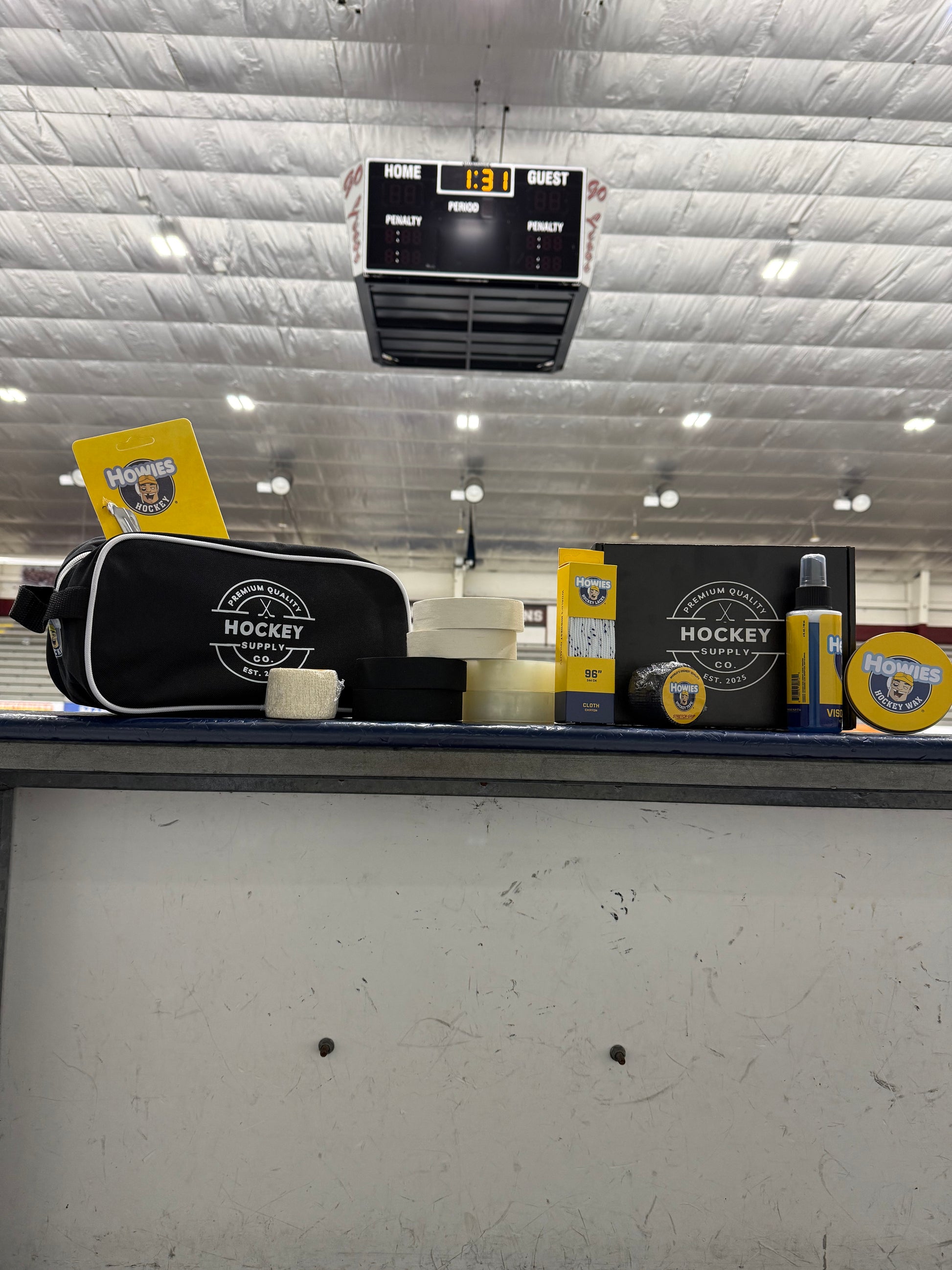 Hockey equipment including a stick and helmet on a textured surface